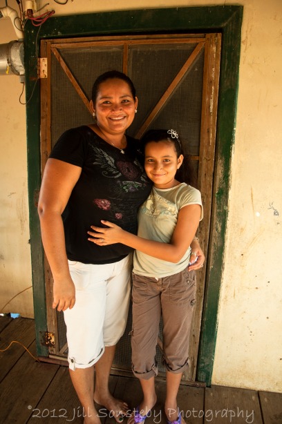 Mother and daughter in front of their house in campolacho.