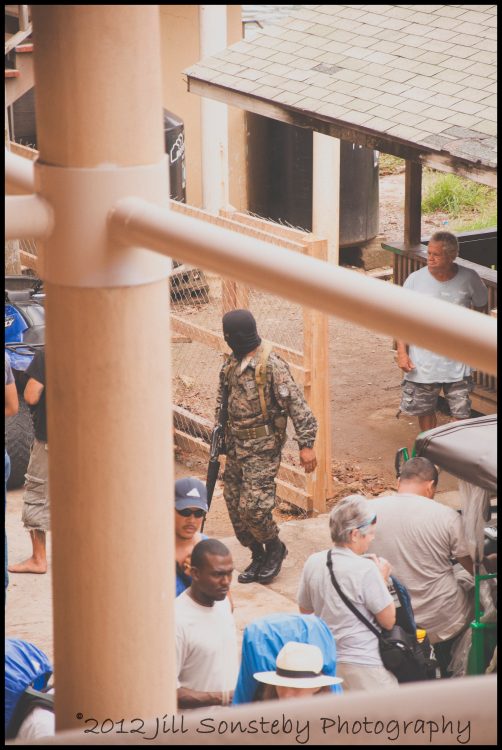 masked military on Utila A masked military man is making his way through the ferry crowd in Utila, Honduras.