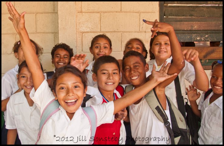 Kids swarm us when we get to the public school of Utila, Honduras. 
