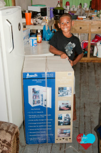 little boy excited about the new fridge after not having one