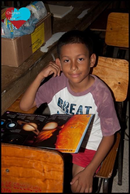 Joel reading the planets book